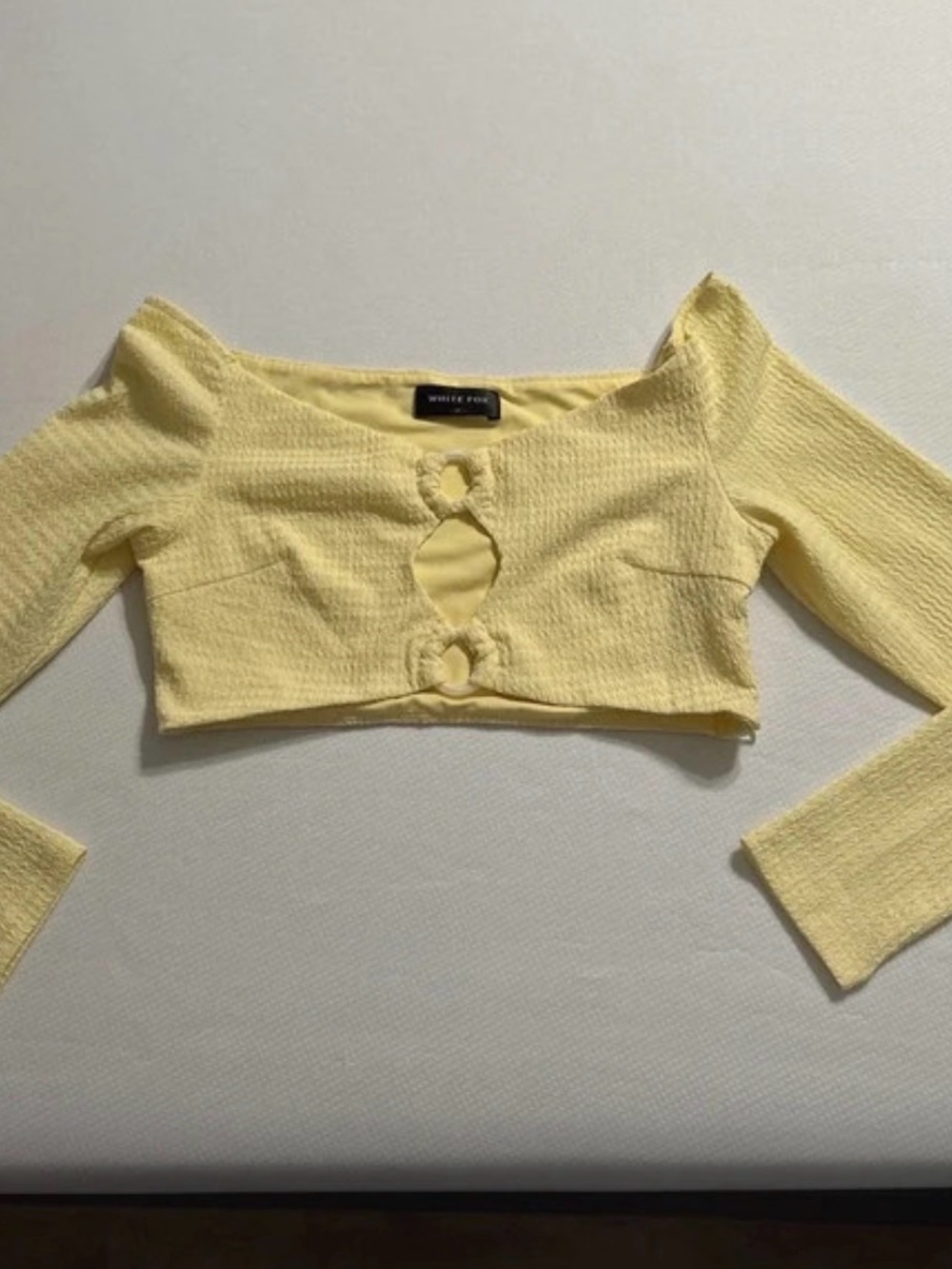 White Fox Boutique Pale Yellow Long-Sleeve Crop Top with Front Cutouts